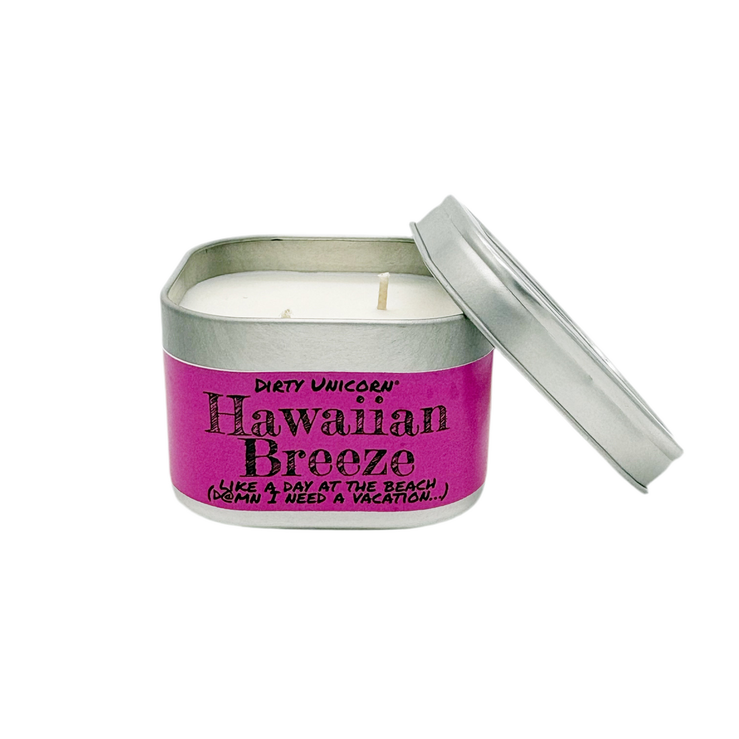 Candle in a tin with 'Dirty Unicorn Hawaiian Breeze' label on a white background