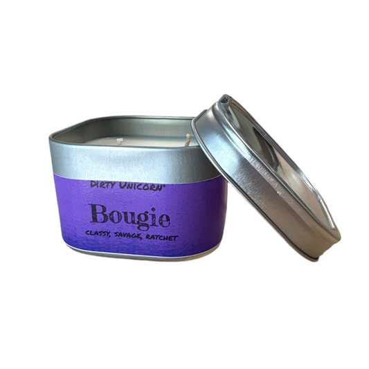 Purple candle in a tin with a silver lid on a white background