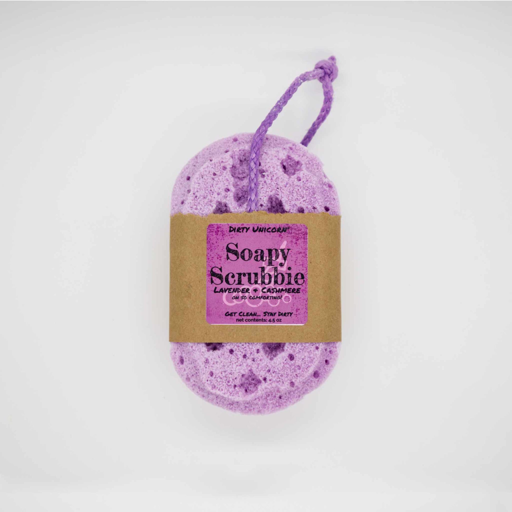 Light purple bath sponge with coordinating rope for hanging. on blank white background. Sponge is wrapped in brown Kraft paper belly band with a purple label barring product title